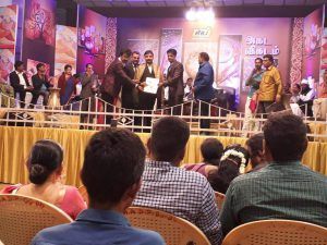 Dr. Sundara receiving an award for his service to the Nilgiris region